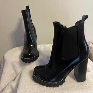 Brand new gorgeous Jeffery Campbell black ankle heeled boots. 4.5 heel
